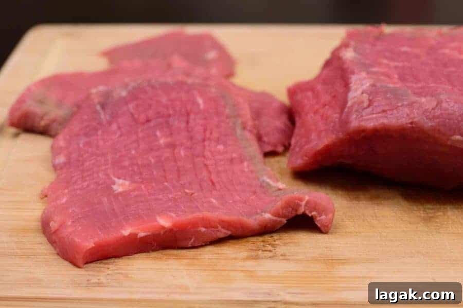 Lean Eye of Round Roast Sliced Thin and Ready to Marinate