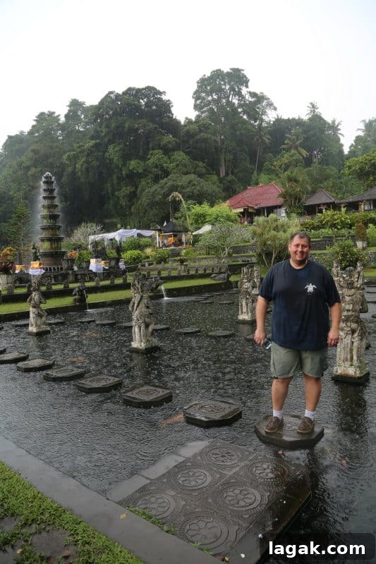 John standing on concrete pavers in the middle of a waterway 