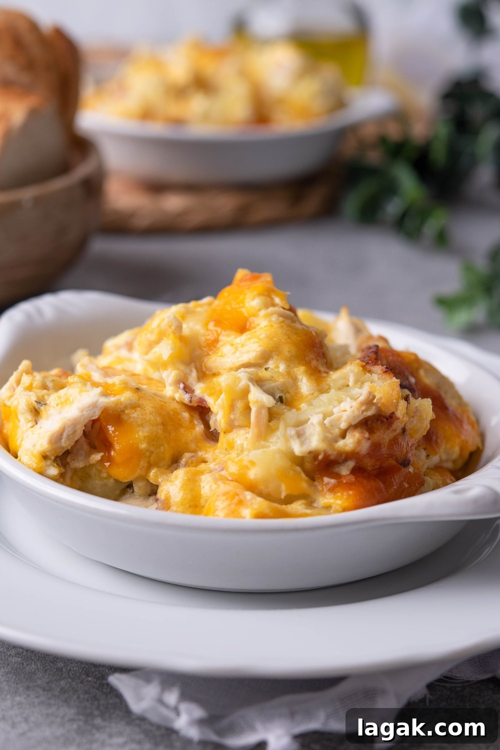 Chicken tater tot casserole in a white bowl.