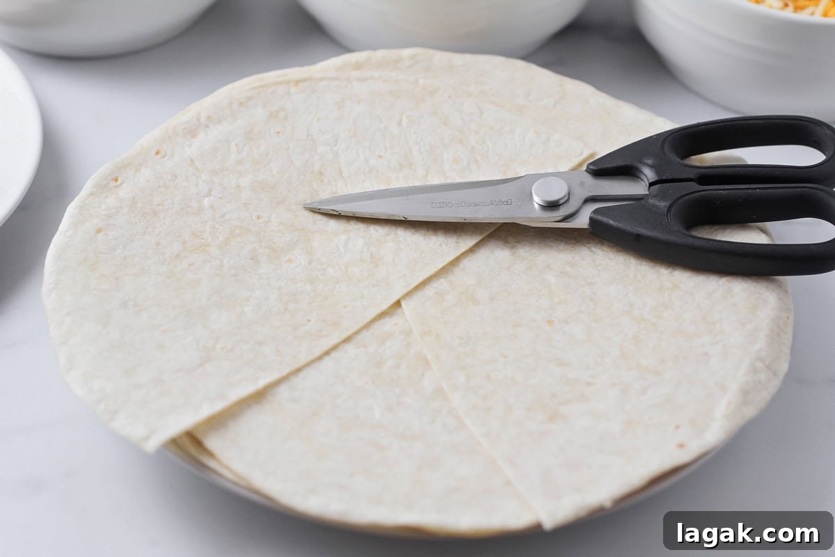 Cutting tortillas to make crunchwrap supreme.