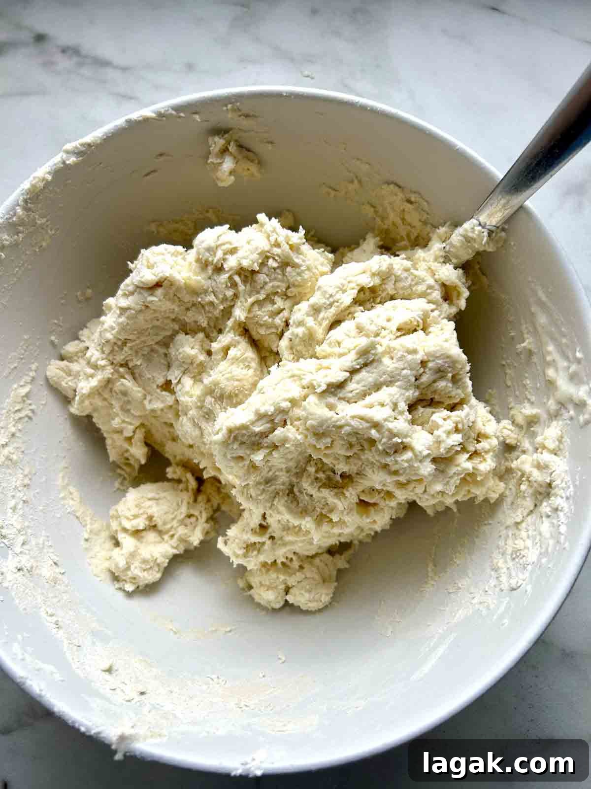 dough coming together in bowl.