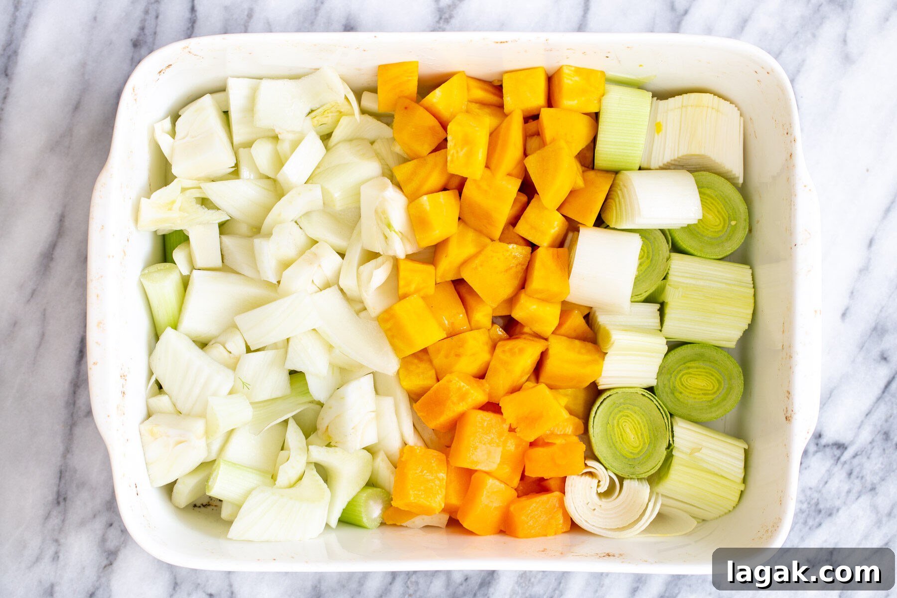 chopped root vegetables in a casserole dish