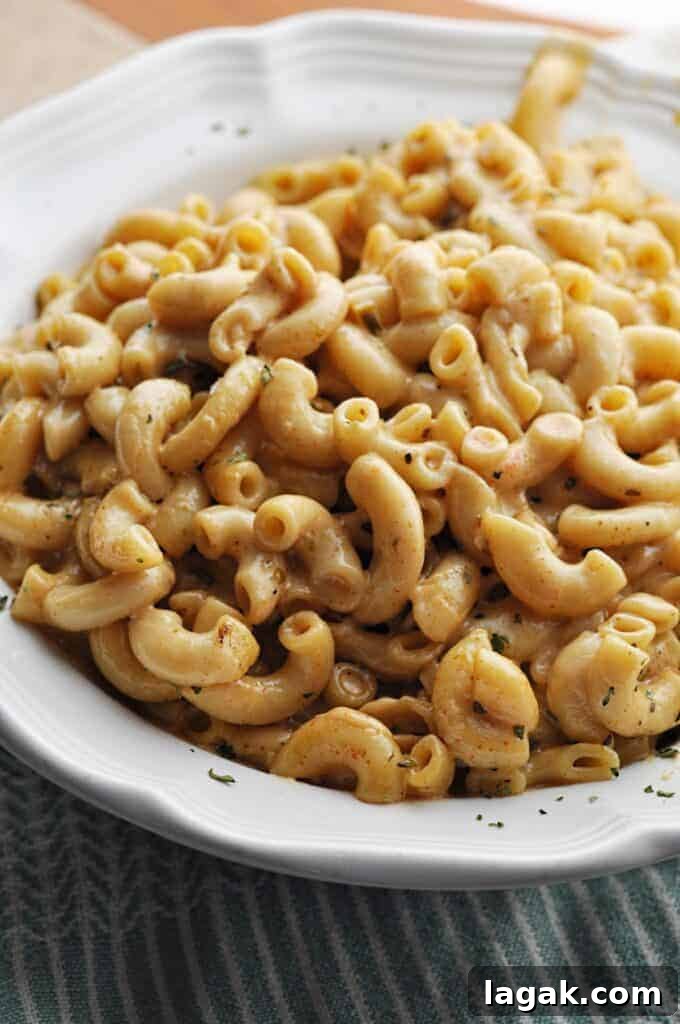 Creamy Mac & Cheese with a spicy kick in white bowl