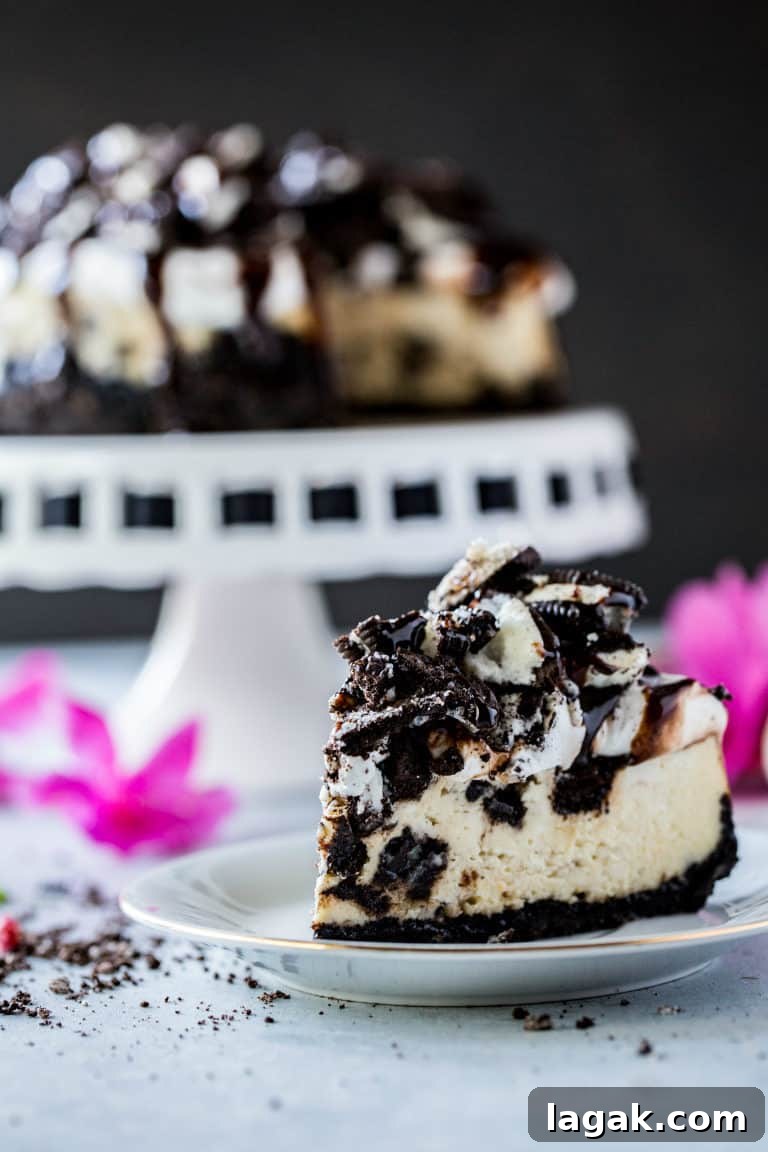 instant pot cheesecake slice on a plate in the foreground with instant pot cheesecake on platter in background