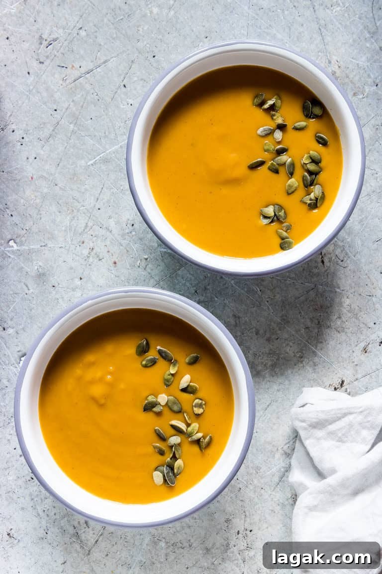 2 bowls of instant pot butternut squash soup with pumpkin seeds