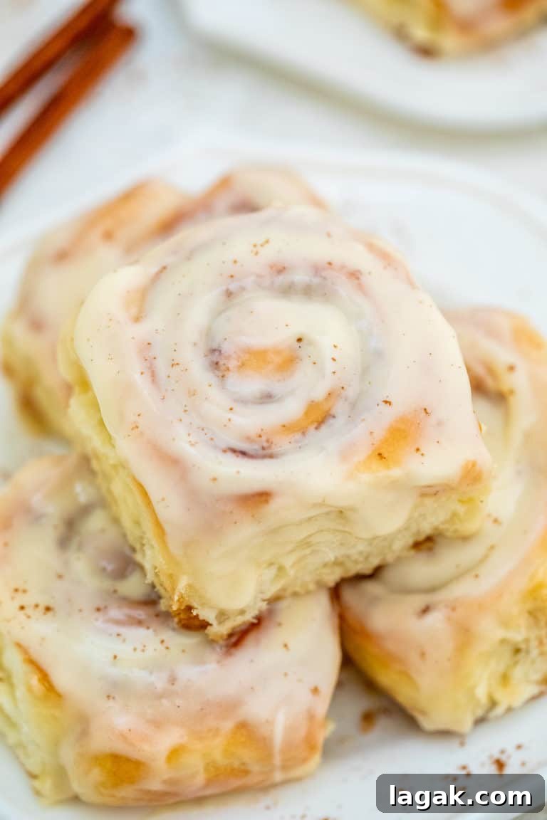 a plate of 3 instant pot cinnamon rolls ready to be served