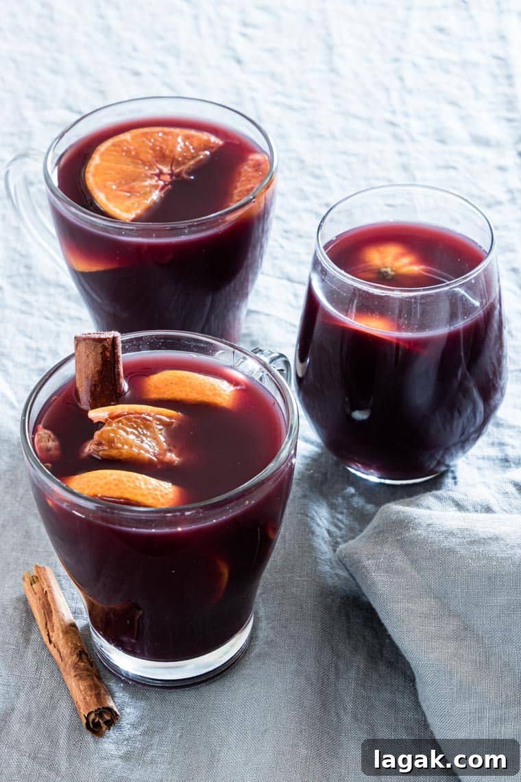 three glasses of orange mulled wine
