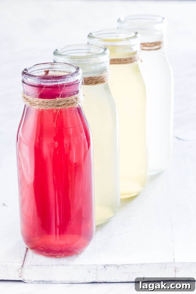 four bottles of instant pot infused water on a white table