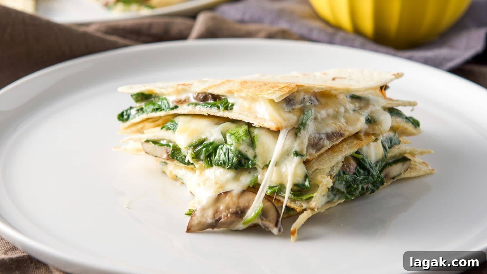 a plate with three quarters of a quesadilla piled on top of each other