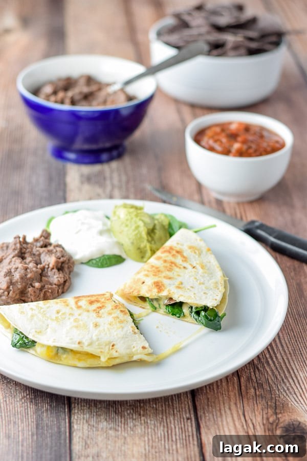 super tasty mushroom and spinach quesadillas cut in half and ready to eat