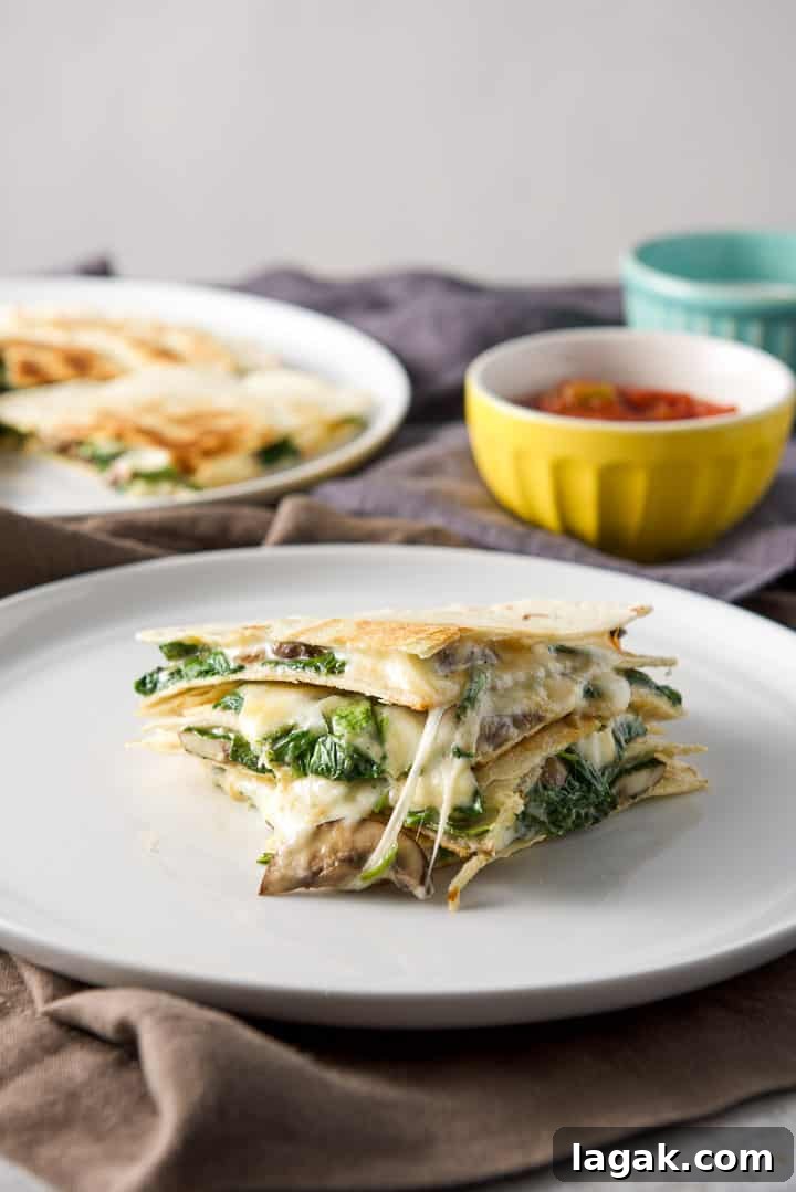 Vertical closeup of the mushroom and spinach quesadillas