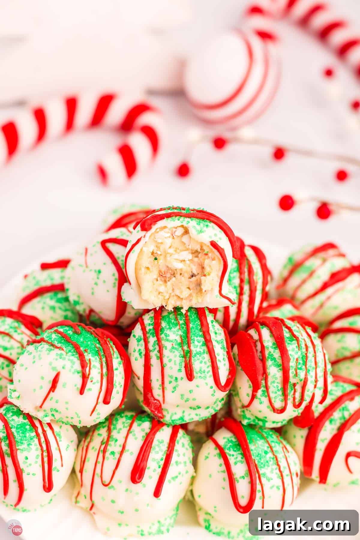 stack of Christmas tree cake balls with the top one missing a bite