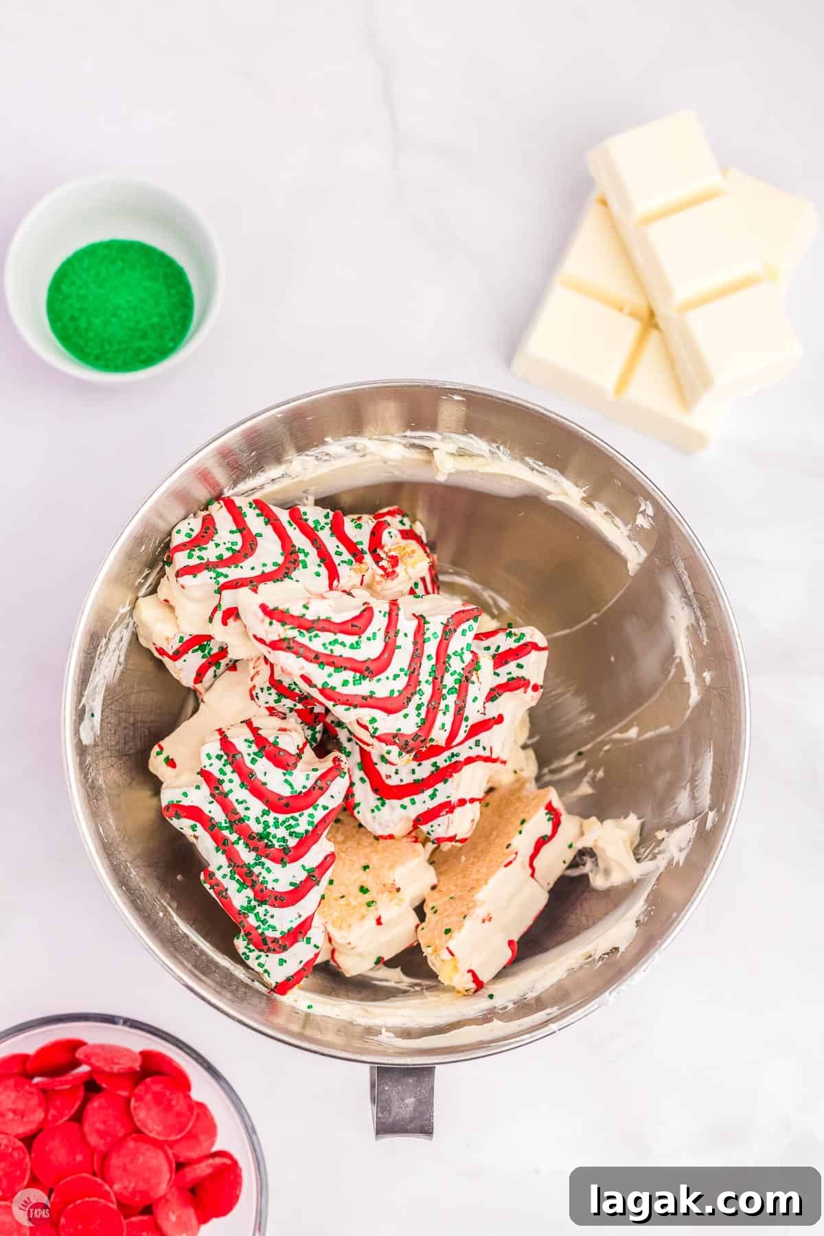 Christmas tree cakes in a metal mixing bowl
