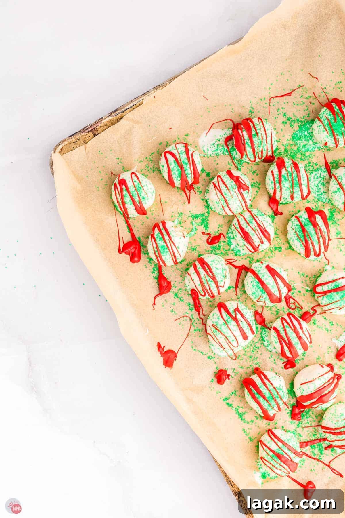 Christmas tree cake balls on a baking sheet with parchment paper