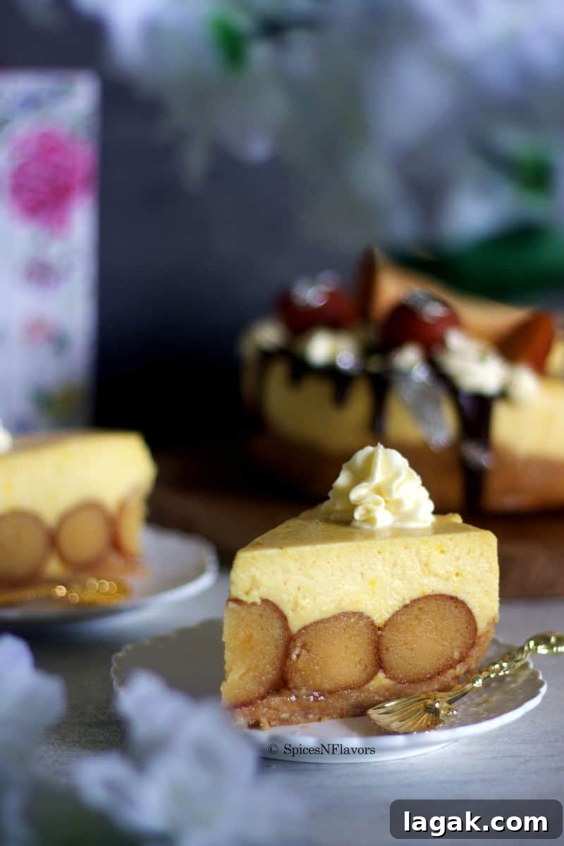 slice of gulab jamun cheesecake revealing the gulab jamuns stuffed within