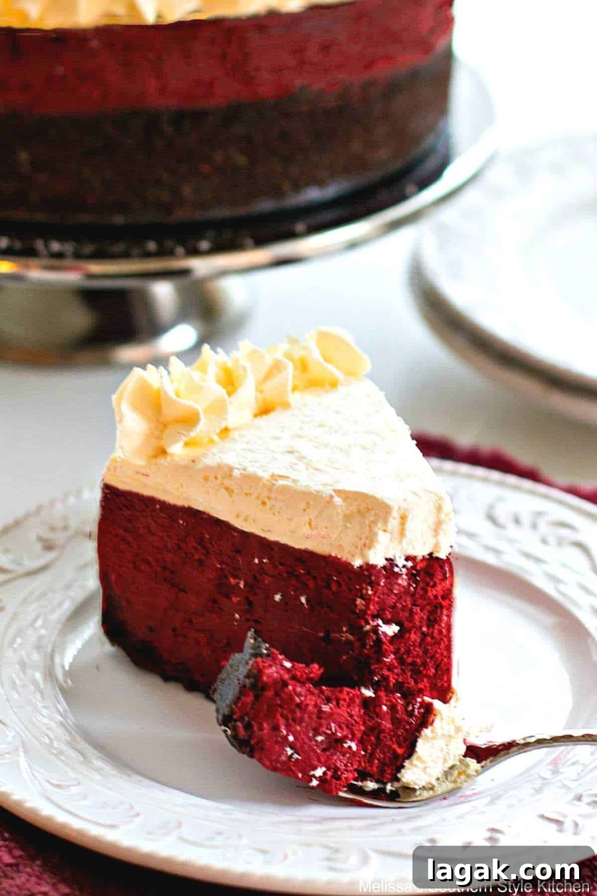 a bite of Red Vevet Cheesecake cut using a spoon