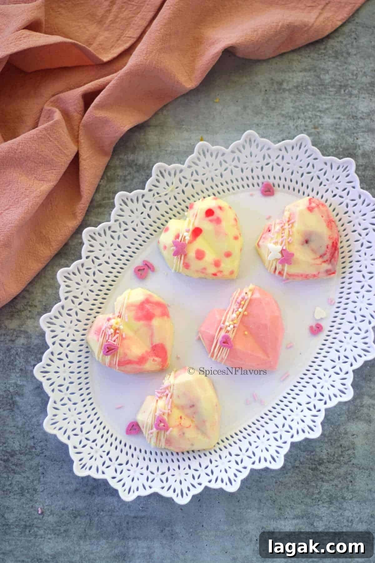 no bake cheesecake in heart chocolate shape with designs on top