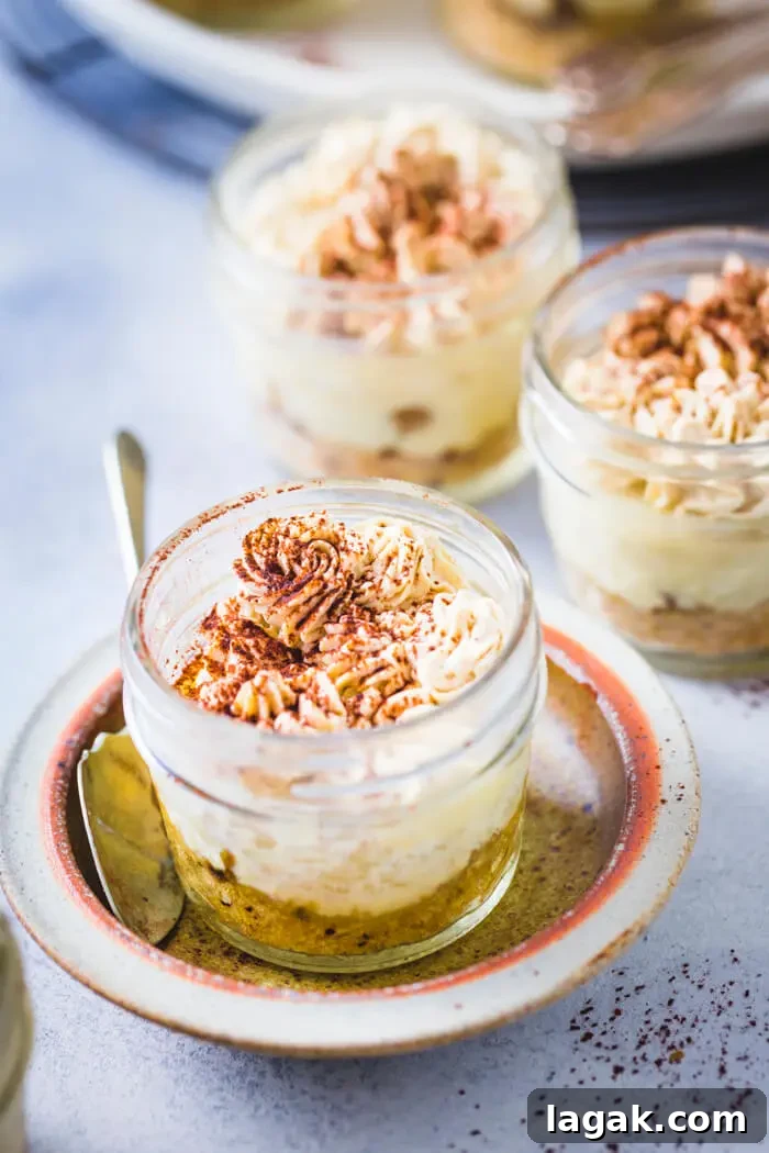 mason jar filled with tiramisu cheesecake and placed on a plate
