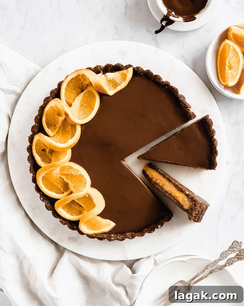 Vegan Chocolate Orange Cheesecake decorated with orange slices