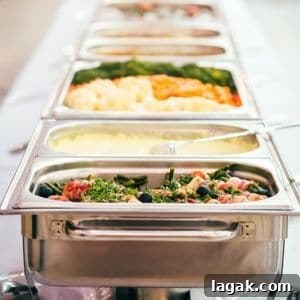 Chafing dishes on a buffet table.