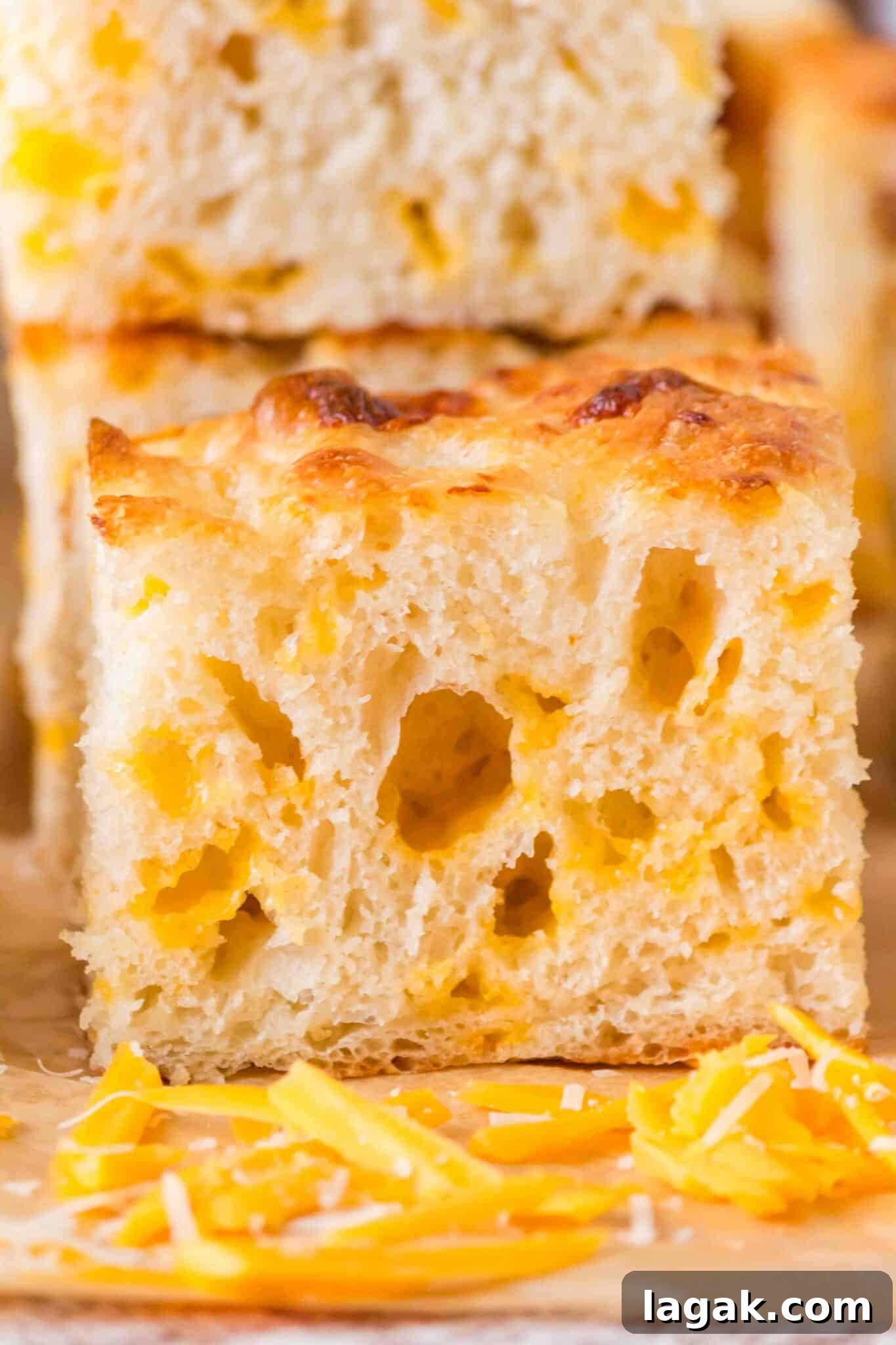 up close side view of a piece of cheese focaccia