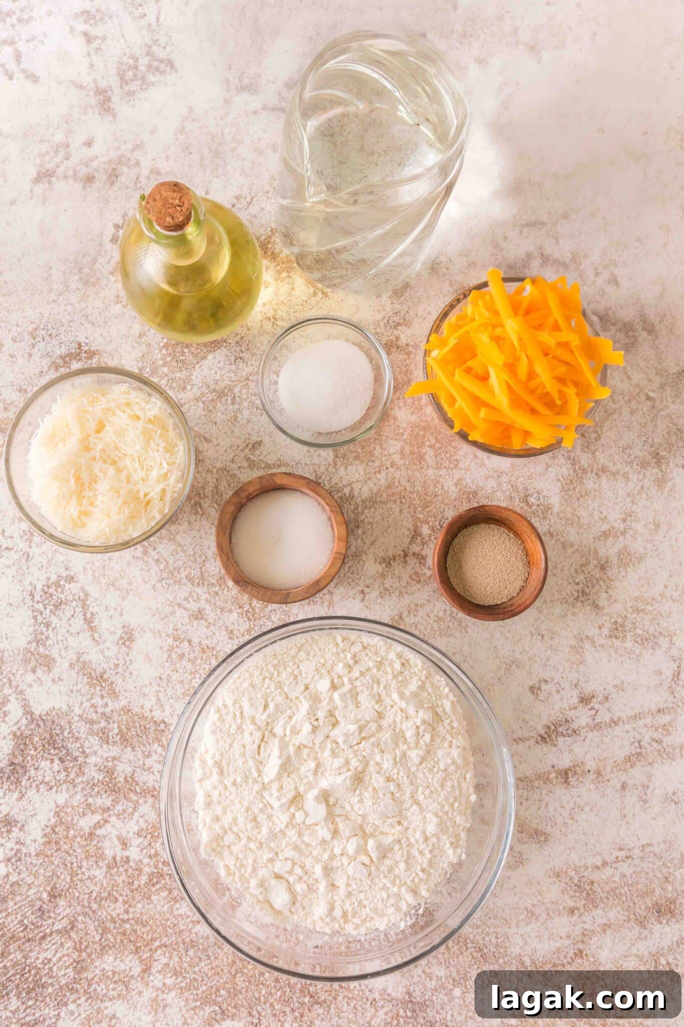 overhead view of raw ingredients needed to make homemade cheese focaccia
